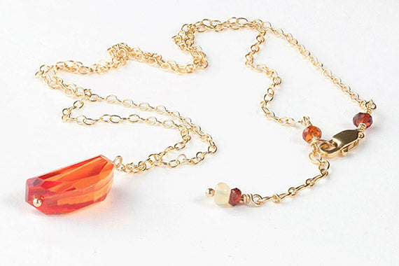 Natural Orange Sapphire on Gold