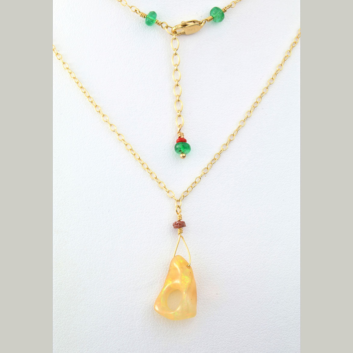Genuine Ethiopian Opal with Emeralds on Gold